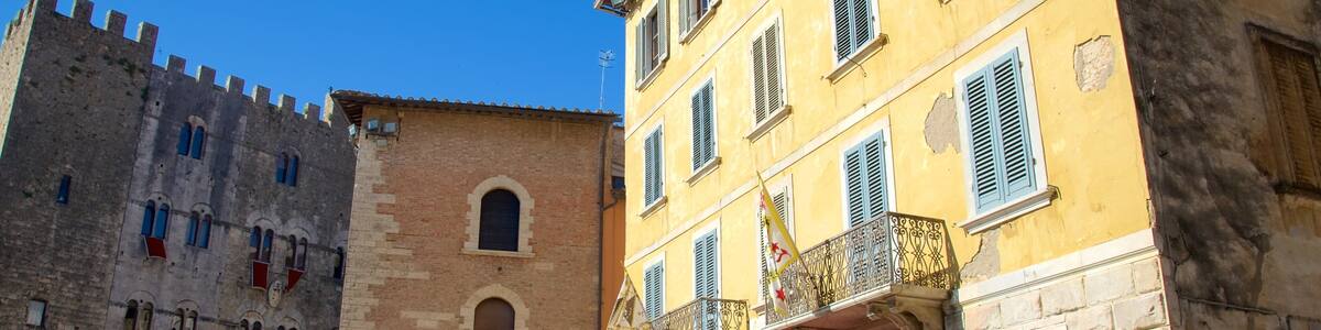 Massa Marittima which includes heritage architecture as well as a small group of people