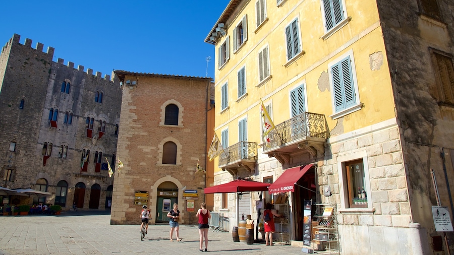 Massa Marittima showing heritage architecture as well as a small group of people