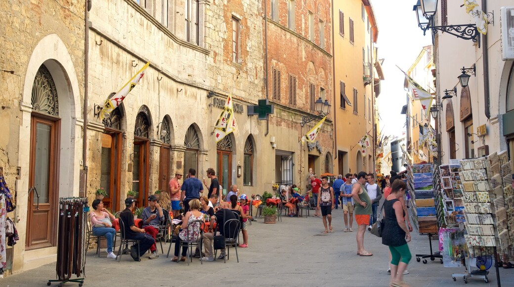 Massa Marittima showing heritage architecture as well as a large group of people