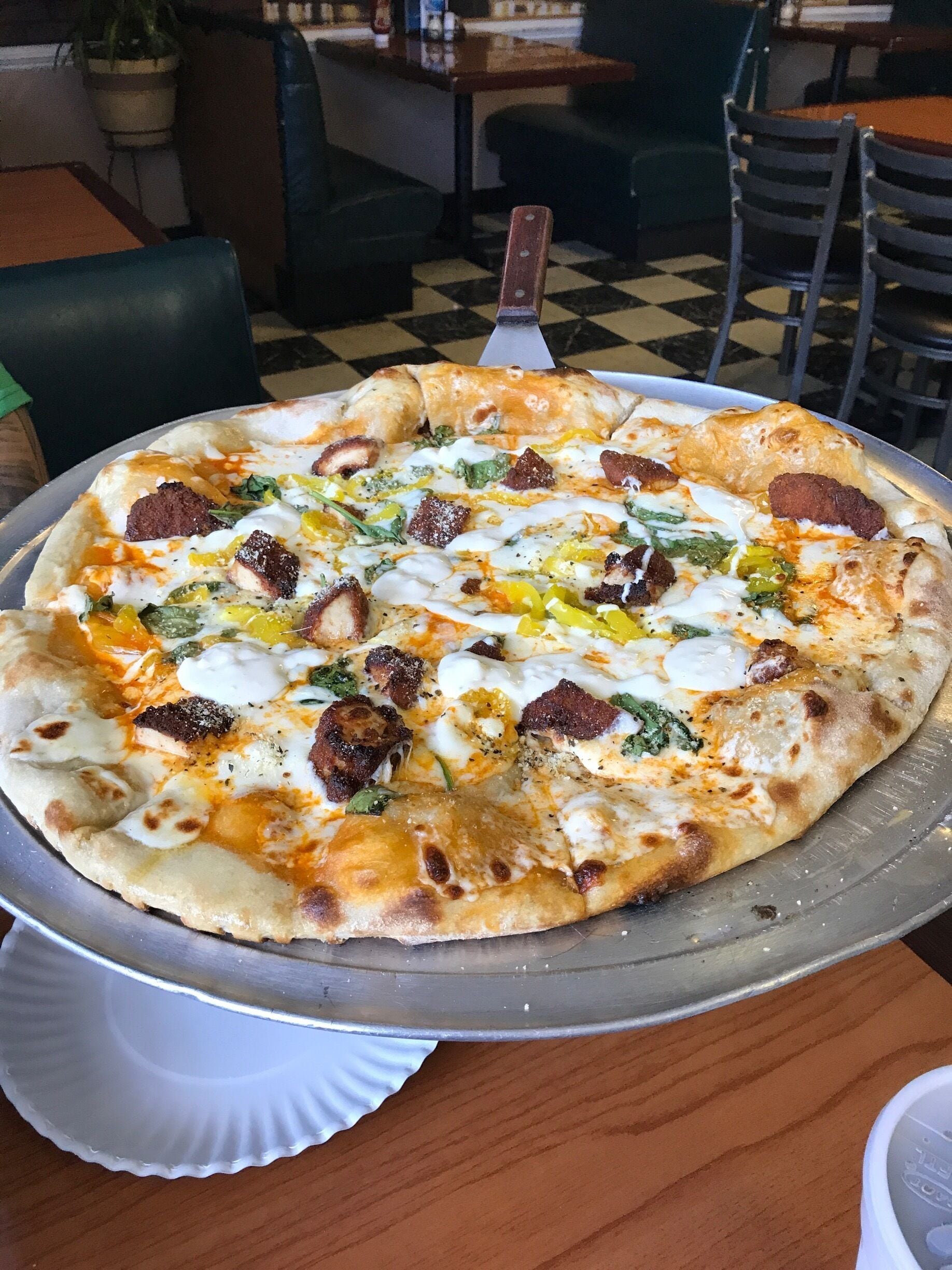 The best pizza i have had in my life! 
Buffalo Chicken Specialty Pizza: spicy buffalo chicken, banana peppers, spinach, buffalo sauce, ranch or bleu cheese. 