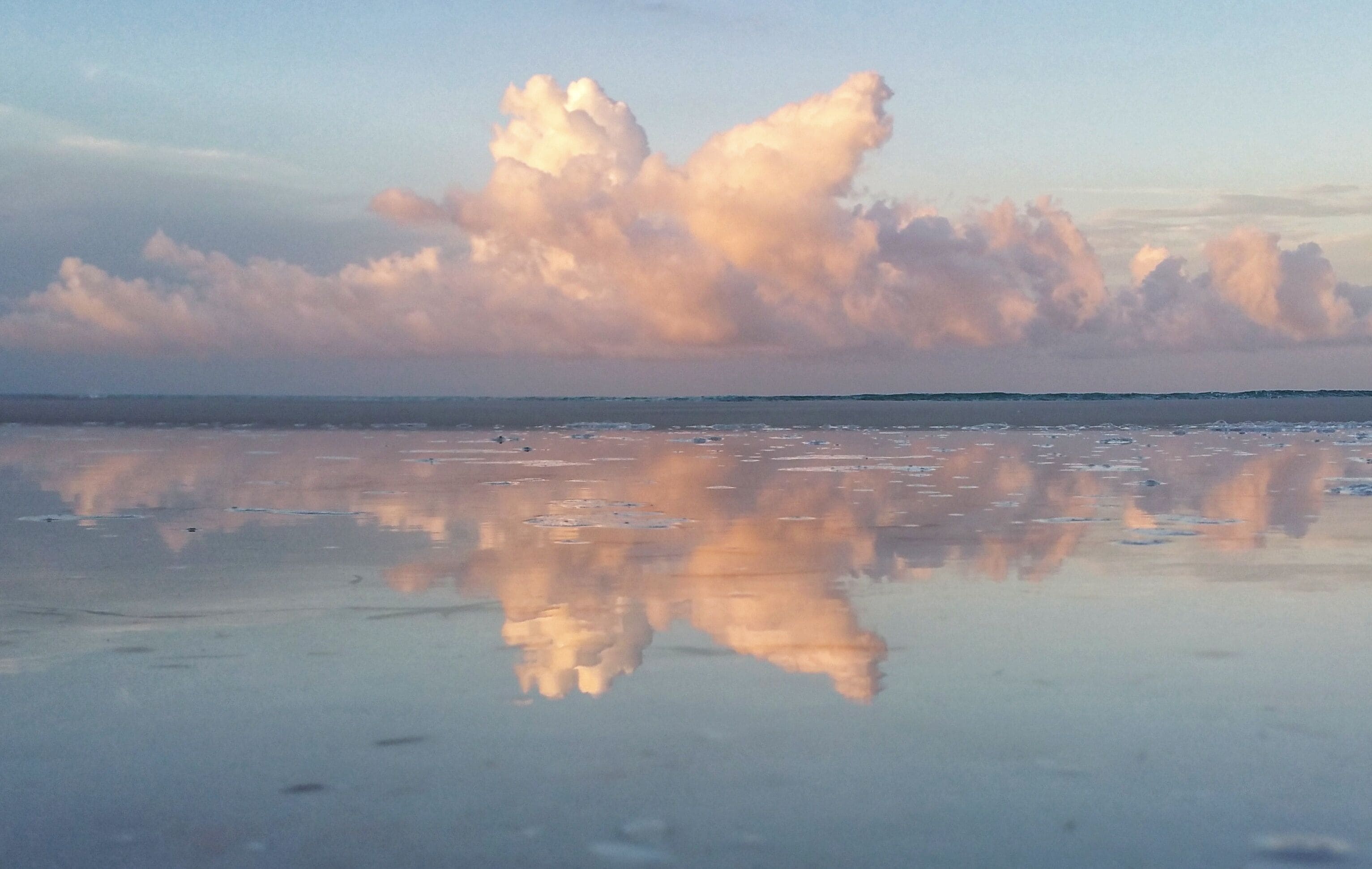 The Gulf has many faces. Dawn brings beautiful pastels to the shore.