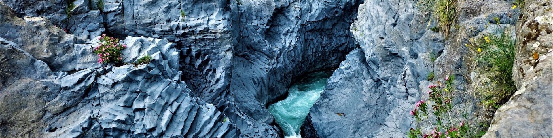 A rocky gorge with a flowing river.