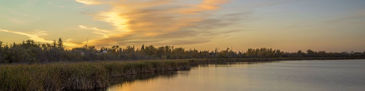 Beautiful shot of a sunset sky over the Crystal Lake in Alberta, Canada