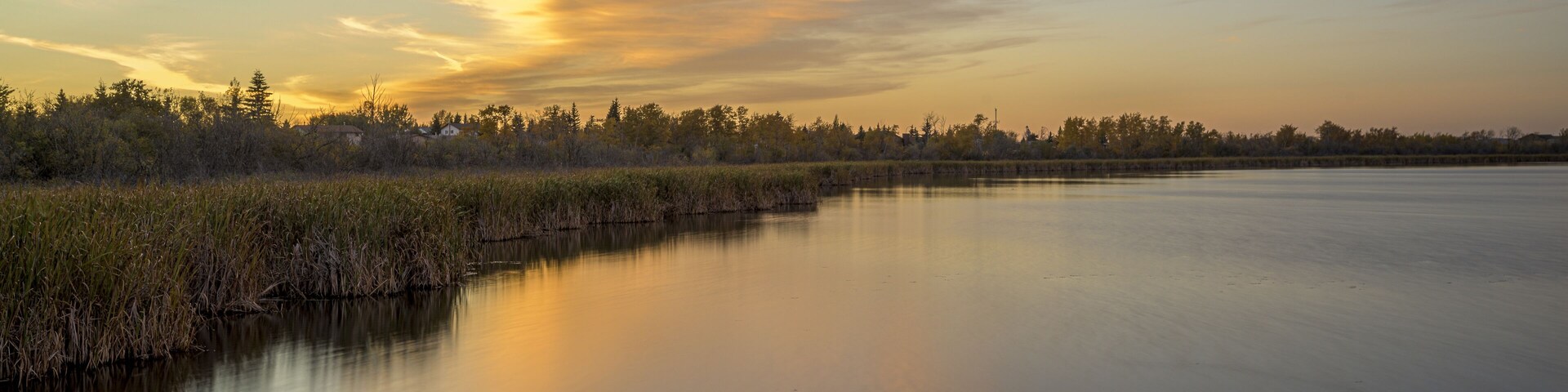 Beautiful shot of a sunset sky over the Crystal Lake in Alberta, Canada
