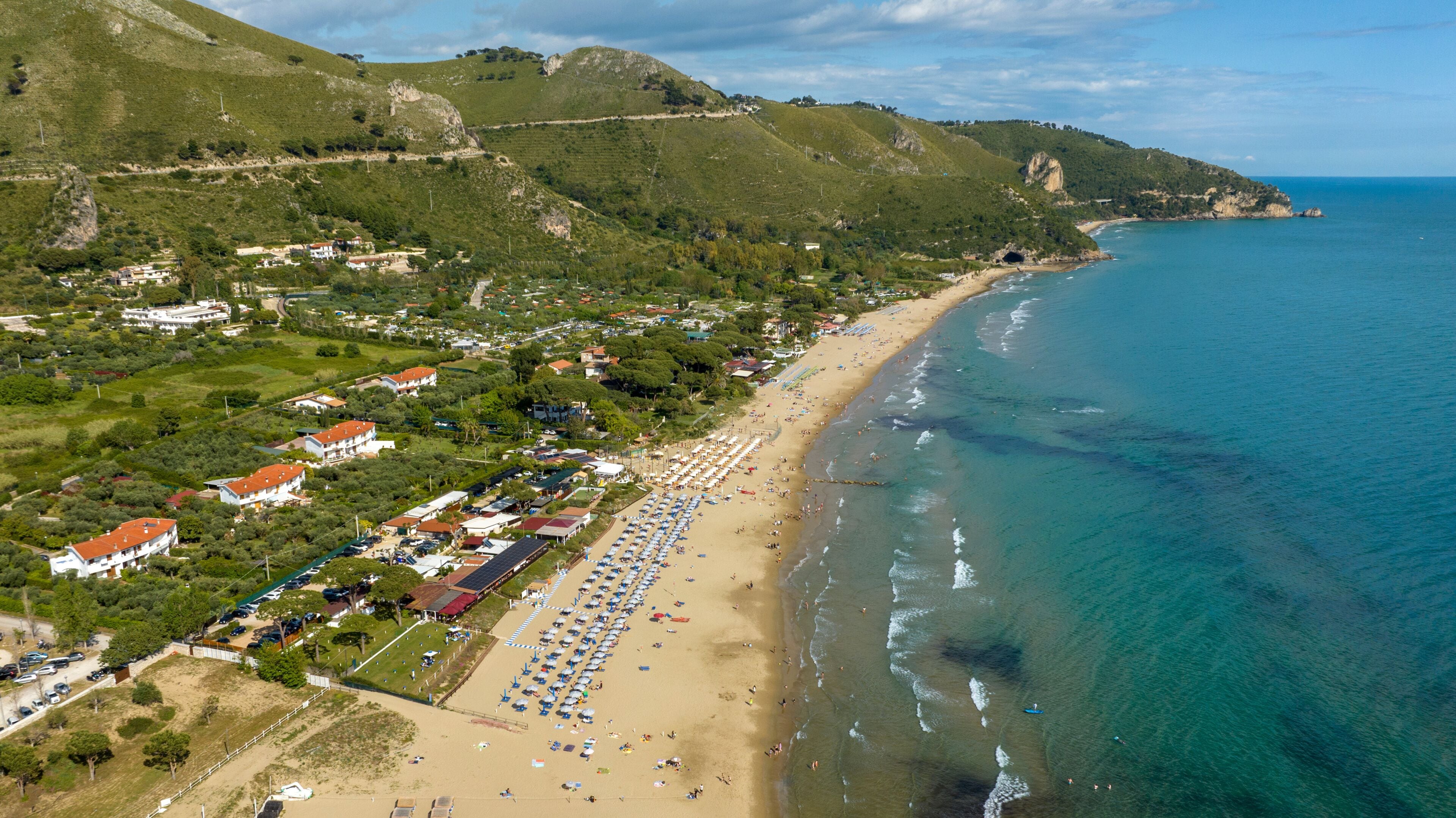 Aerial view of the Levante beach in Sperlonga. It is a tourist destination on the coast in the province of Latina, Lazio, Italy. In the background is the Grotto of Tiberius.
