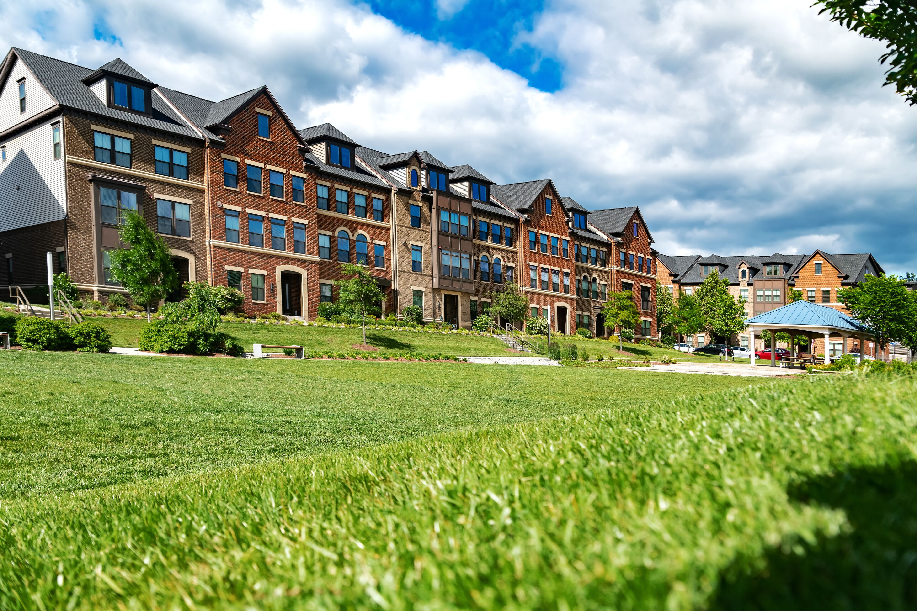 New modern apartment building with green space in Ashburn. Part of an urban property, condominium architecture.