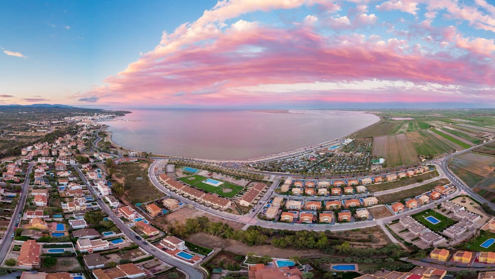 The incredible sunset over the bay of L'Ampolla and Deltebre, Catalonia, Spain. Drone aerial panorama