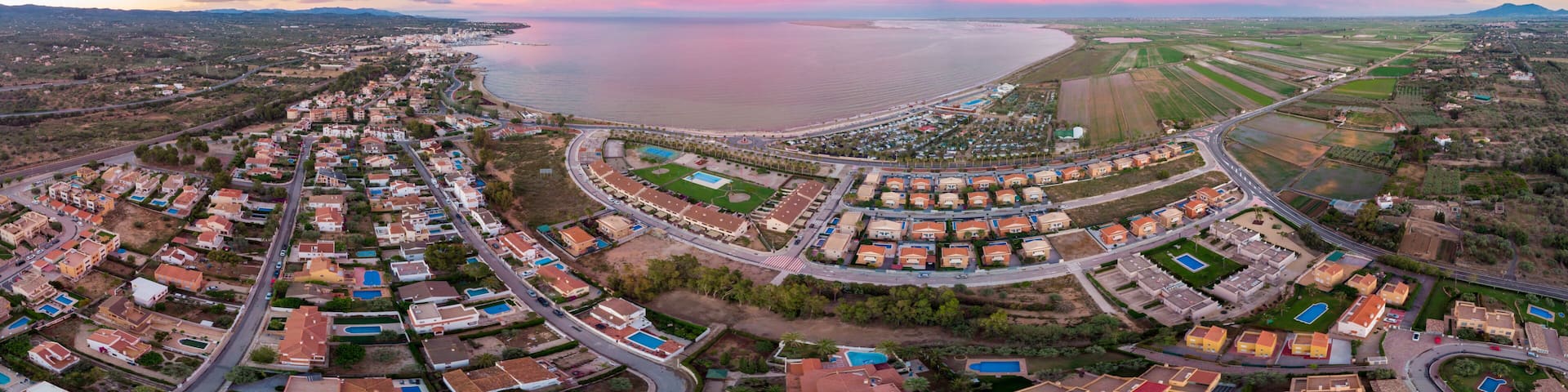 The incredible sunset over the bay of L'Ampolla and Deltebre, Catalonia, Spain. Drone aerial panorama