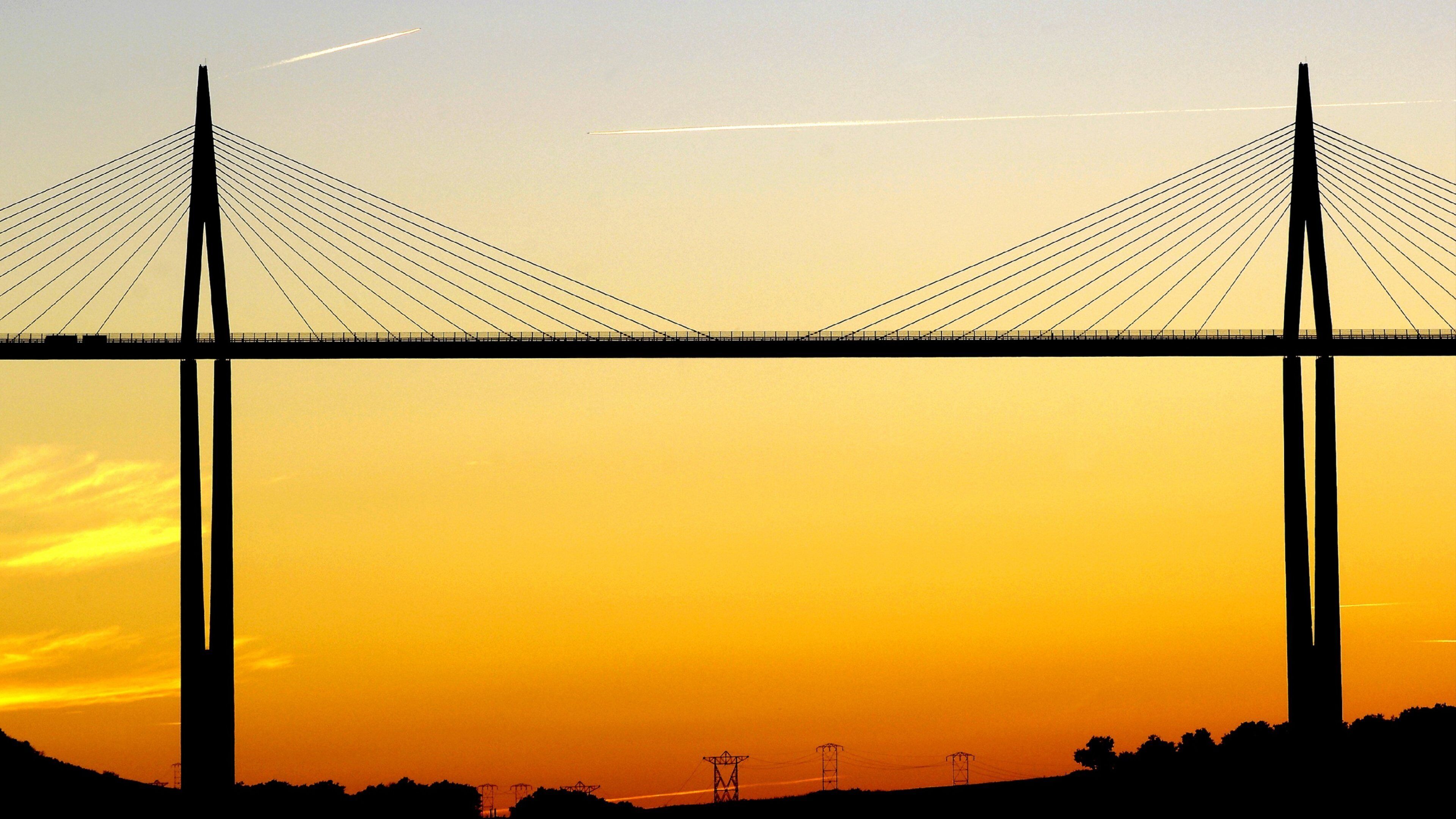 Millau featuring a sunset and a bridge