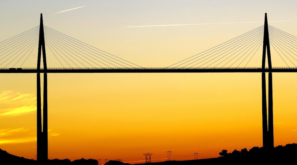 Millau featuring a sunset and a bridge