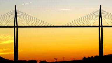 Millau featuring a sunset and a bridge