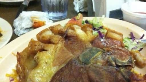 Chuleta CanCan (Pork Chops) Huge Pork Chop with crispy side as we called (Chicharon) make you remember the Flintstones!!