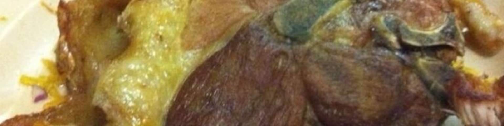Chuleta CanCan (Pork Chops) Huge Pork Chop with crispy side as we called (Chicharon) make you remember the Flintstones!!