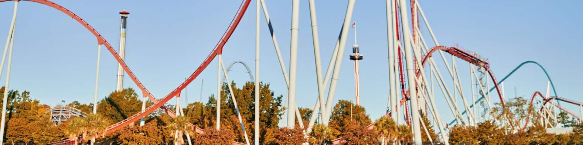 A roller coaster with multiple tracks and a clear blue sky.