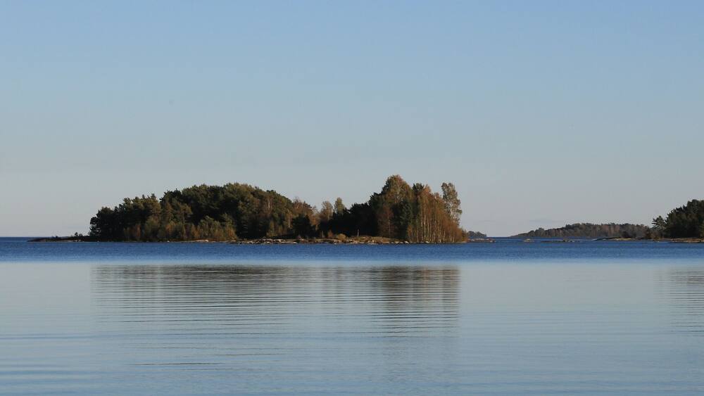 Small islands covered by forest in Lake Vanern, Sweden.