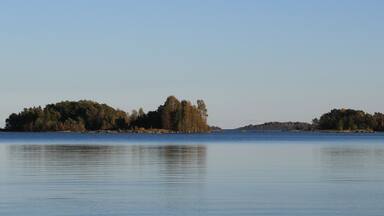 Small islands covered by forest in Lake Vanern, Sweden.