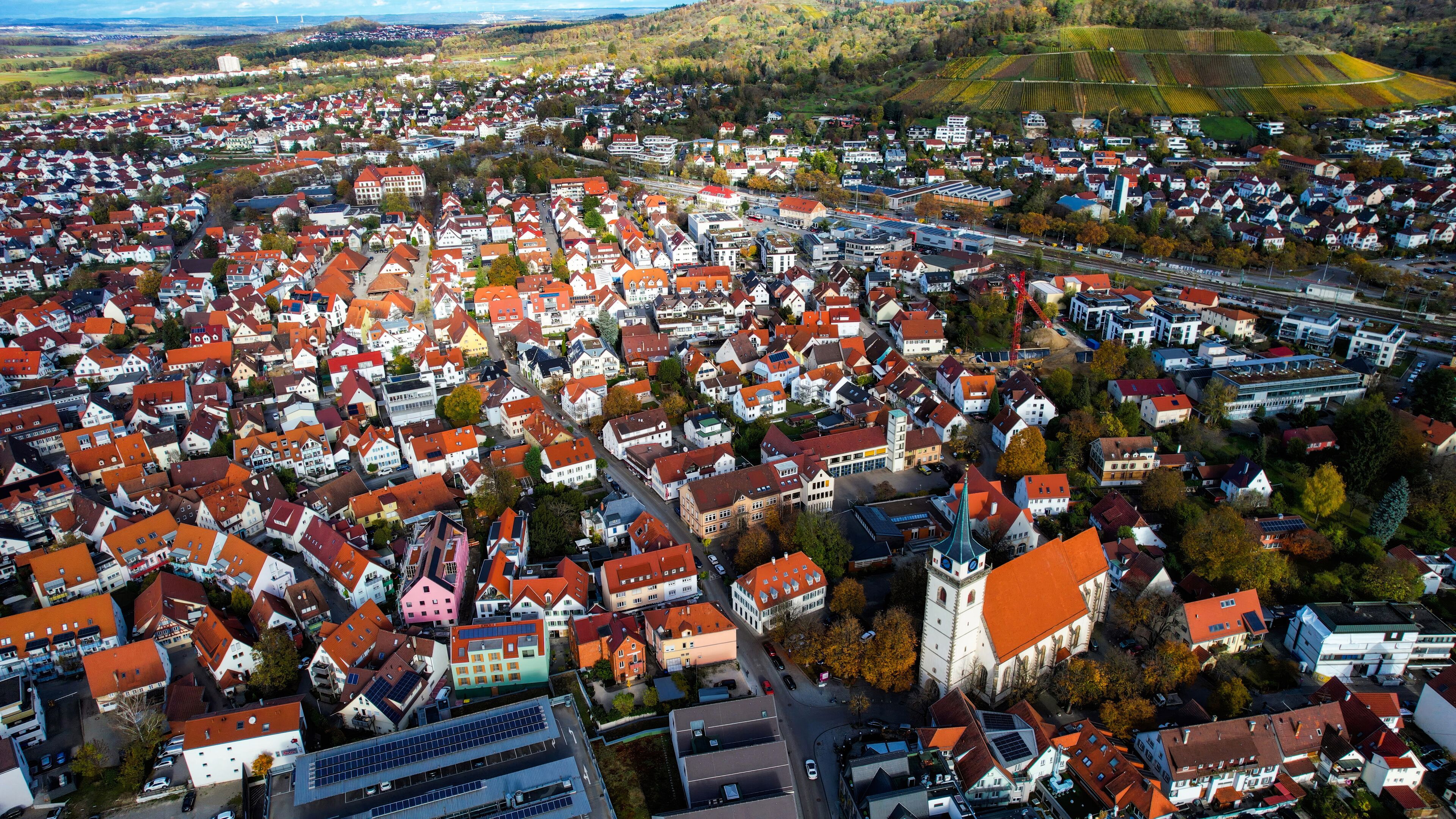 Aerial view of the old town of the city Metzingen
 in Germany on a sunny afternoon in autumn