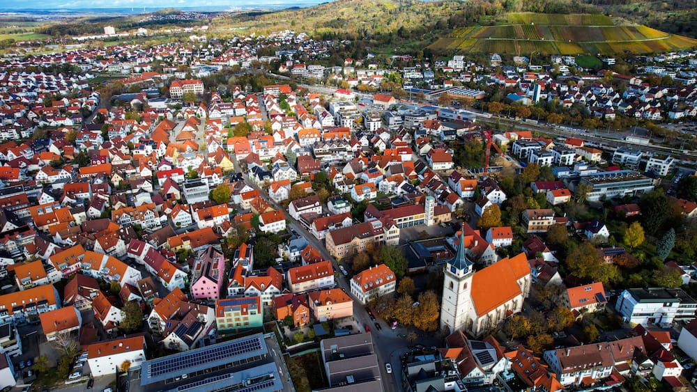 Aerial view of the old town of the city Metzingen
in Germany on a sunny afternoon in autumn