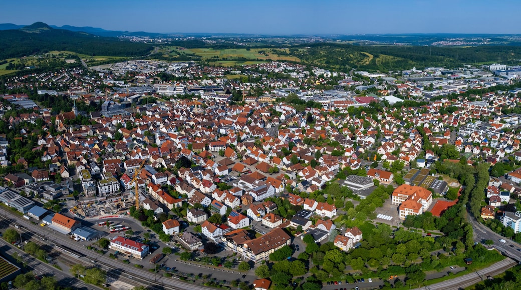 Aerial panoramic view of the city and old town of Metzingen in Germany on a sunny day in summer.