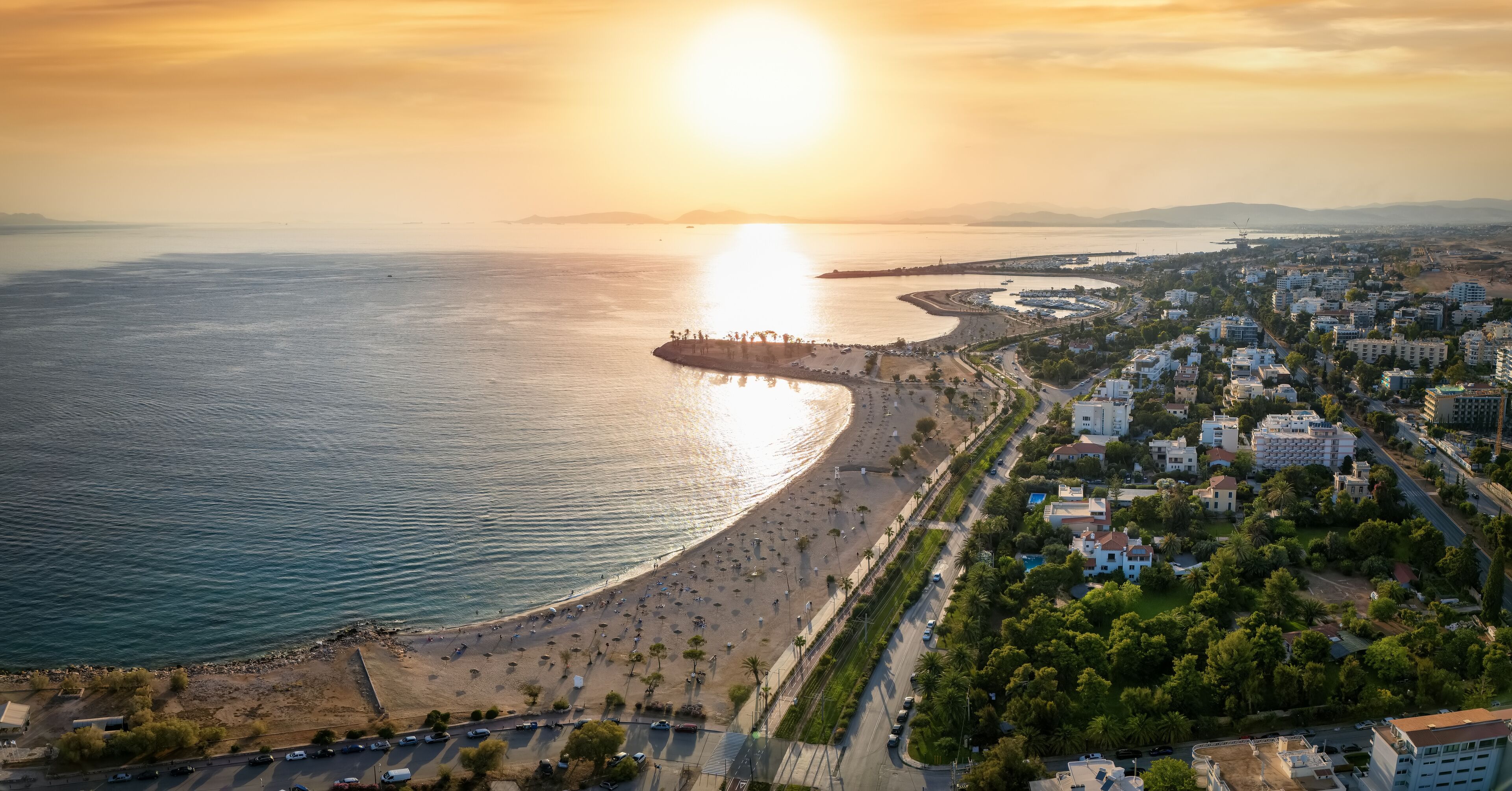 The coastline of Glyfa´da, south Athens, Greece, with beaches and marinas during summer sunset time