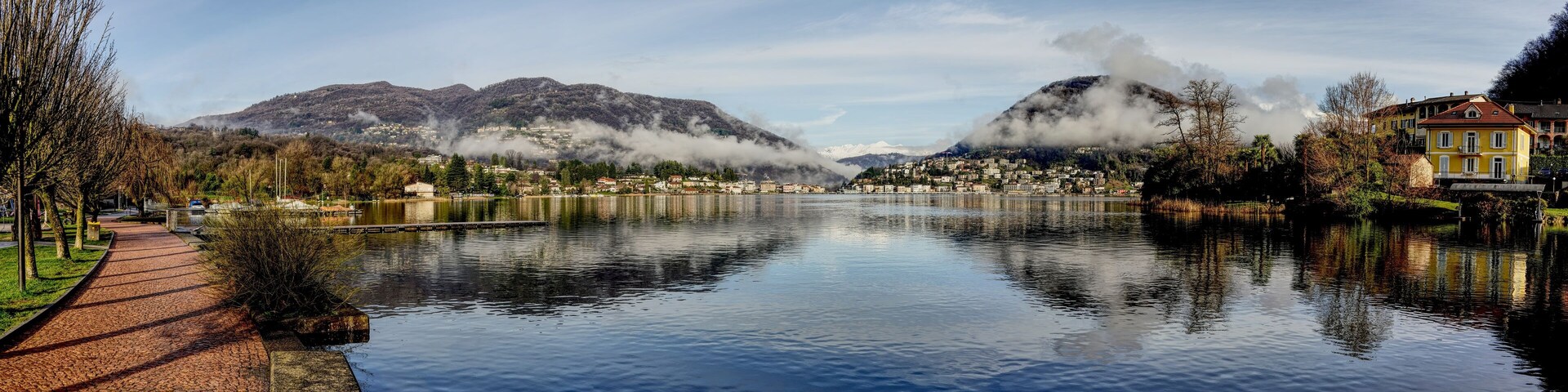 Panorama picture of Lake Lugano between Caslano and Lavena Ponte Tresa.