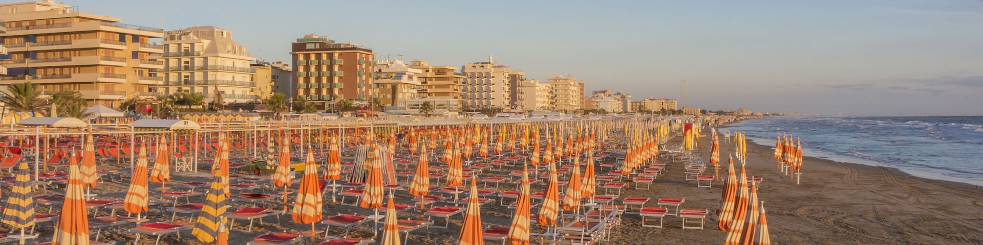 Umbrellas and gazebos on Italian sandy beaches. Adriatic coast. Pictures taken at sunrise, Shutterstock ID 528589936, Purchase Order: SP-1506 Go Guides, Order Number: , Client/Licensee: Faa Praharnpap