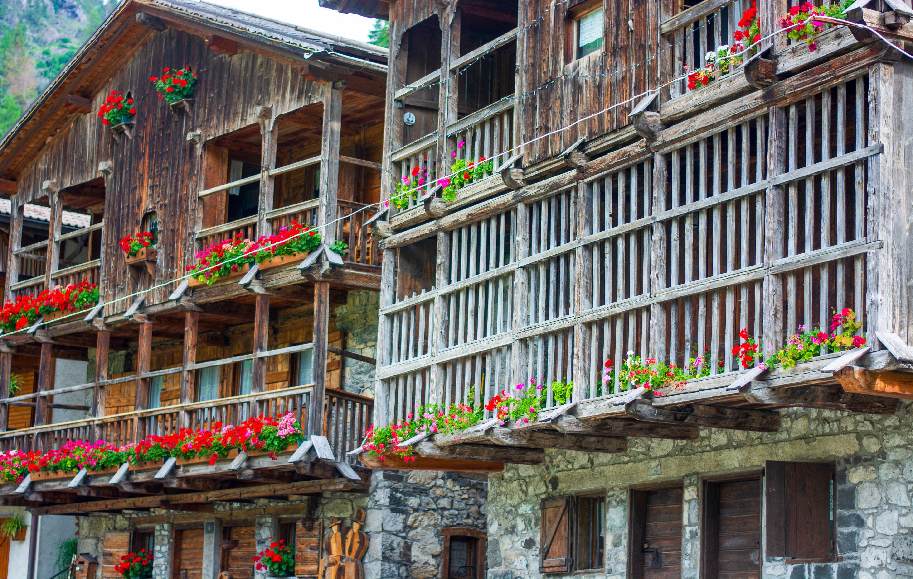 flowered balconies in the traditional ancient wooden houses of Sappada