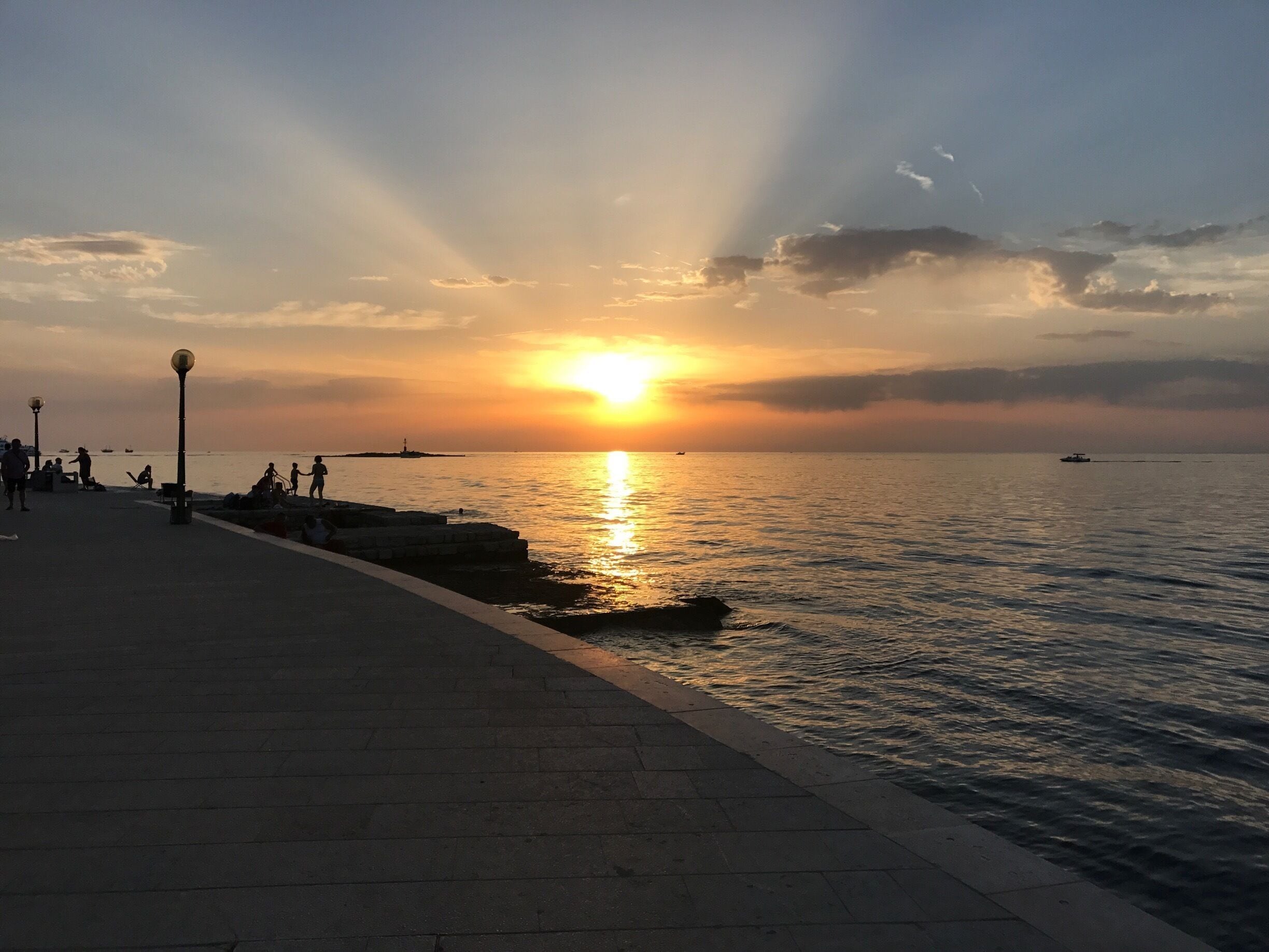 The best place to catch the sunset in Poreč is the promenade around the old town walls