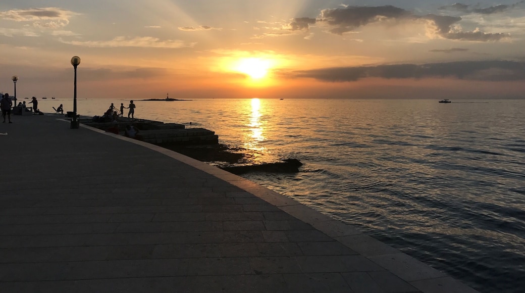 The best place to catch the sunset in Poreč is the promenade around the old town walls