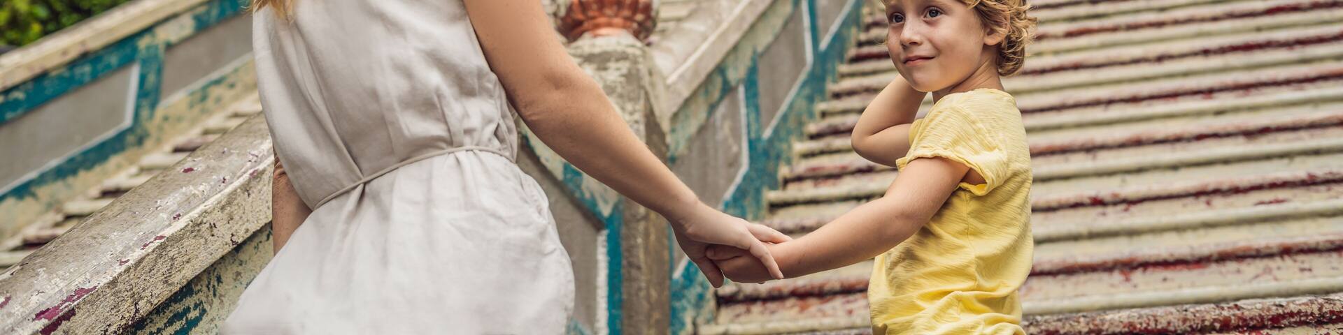 Mom and son in the background of Batu Caves, near Kuala Lumpur, Malaysia. Traveling with children concept