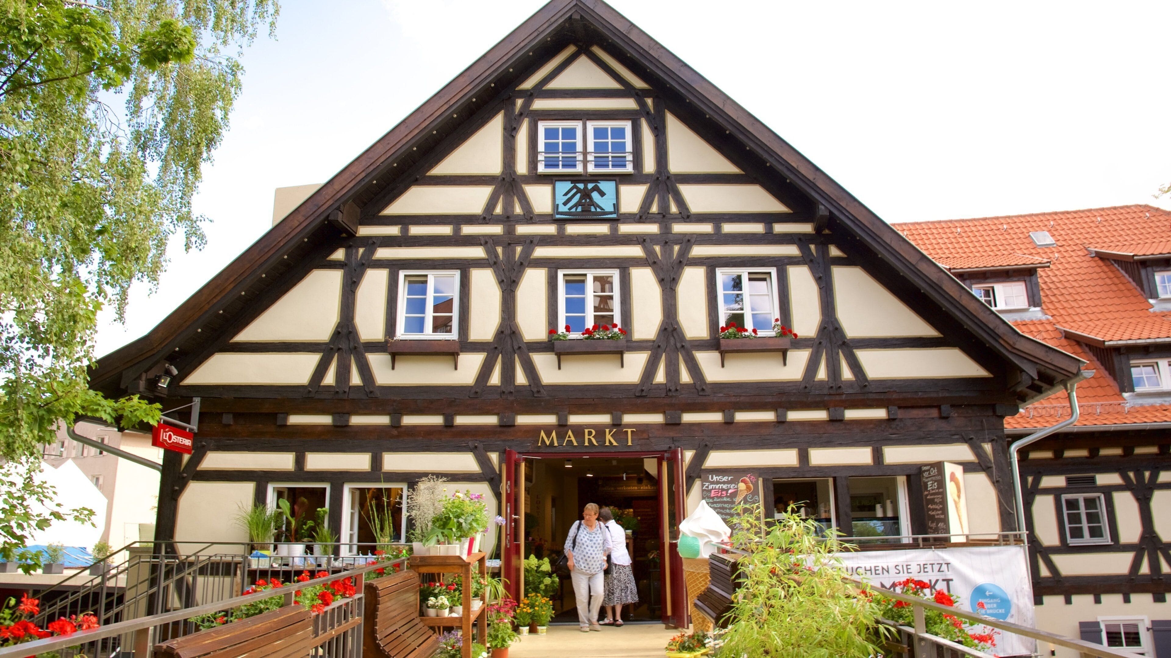 A traditional half-timbered building with a sign reading "MARKT".