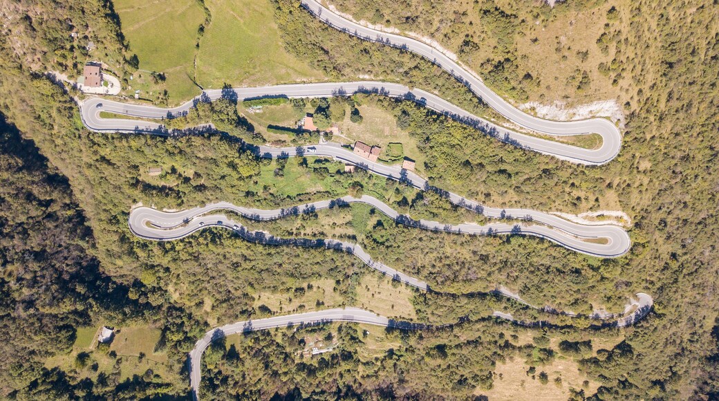 Drone aerial view of the mountain road in Italy from the village of Nembro to Selvino. Amazing aerial view of the mountain bends creating beautiful shapes