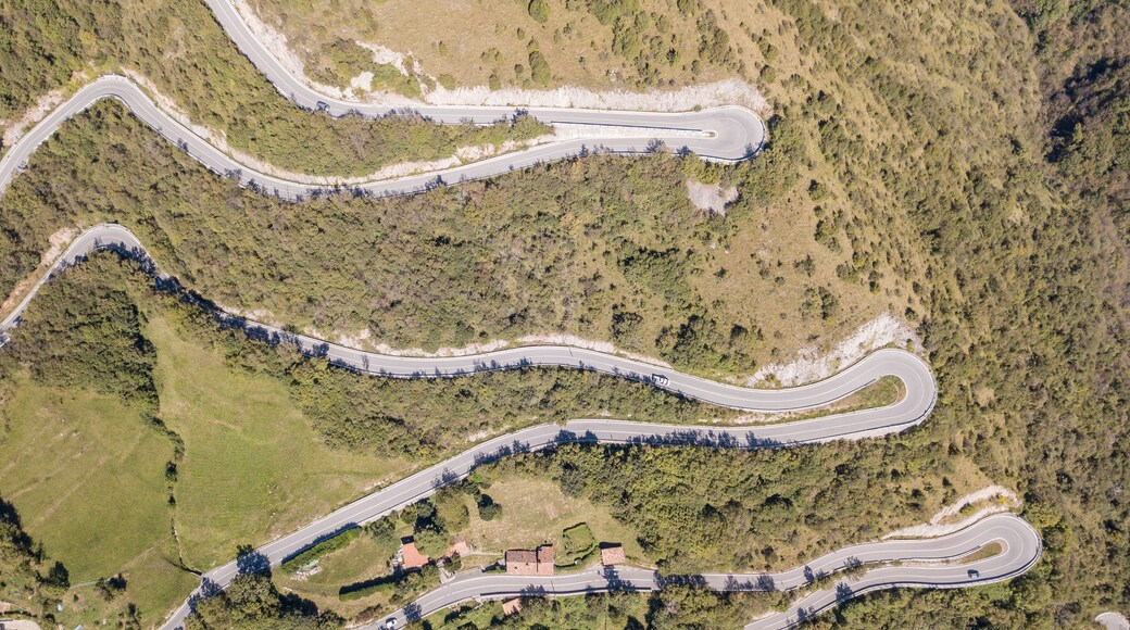Drone aerial view of the mountain road in Italy from the village of Nembro to Selvino. Amazing aerial view of the mountain bends creating beautiful shapes