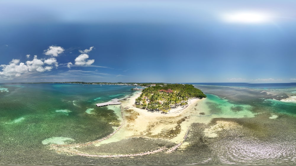 360 aerial photo taken with drone of Bando Beach on the island of Utila, Honduras
