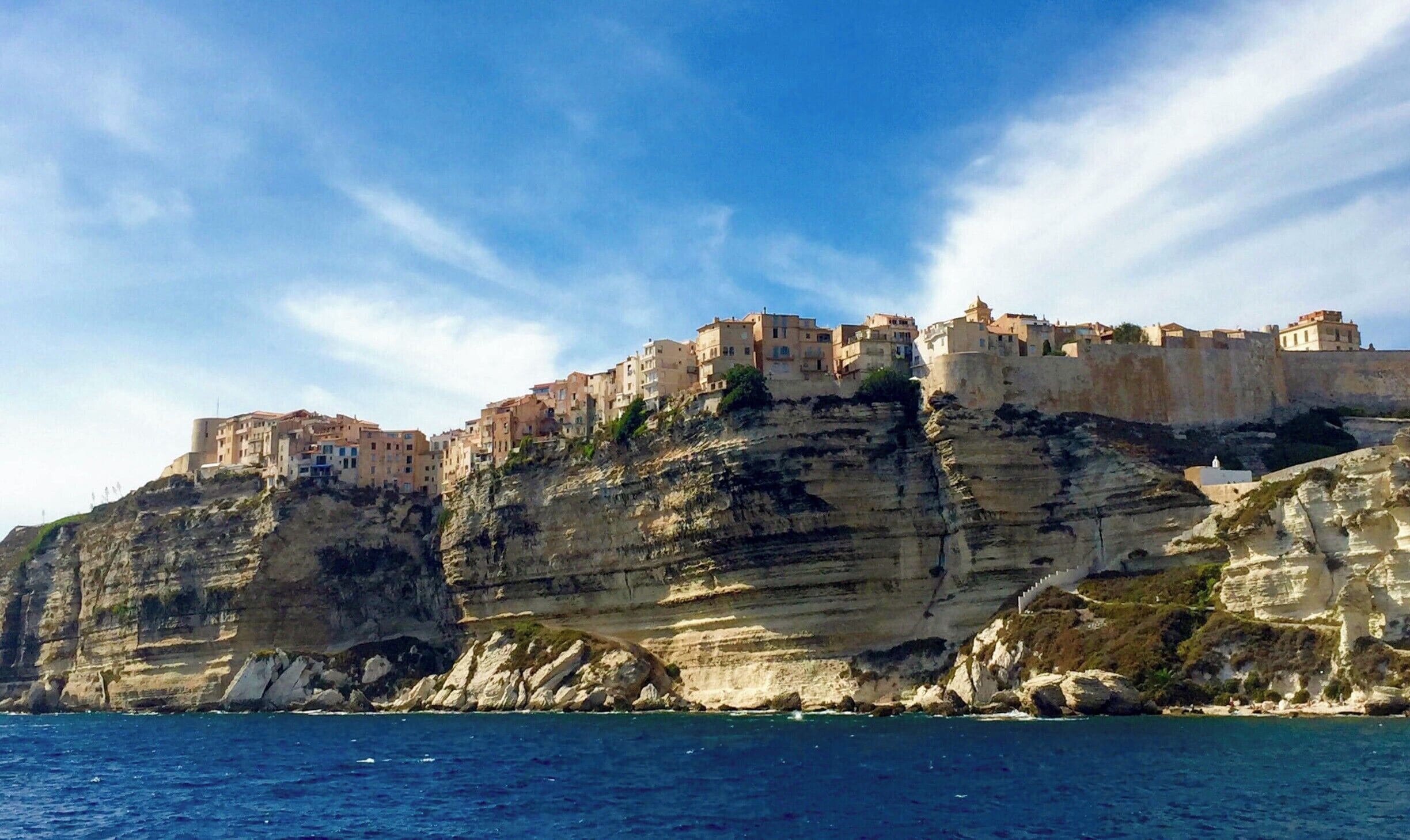 While we do not have the ability to time travel, we can certainly get a taste of it through adventure to remote places! Visiting the medieval clifftop citadel of Bonifacio will fill you with delight and wonder. Take a boat excursion, such as a tour with SPMB to truly appreciate the limestone cliff landscape and ingenuity of those that settled here centuries ago. #InStone #Bonifacio #Corsica #limestone #citadel