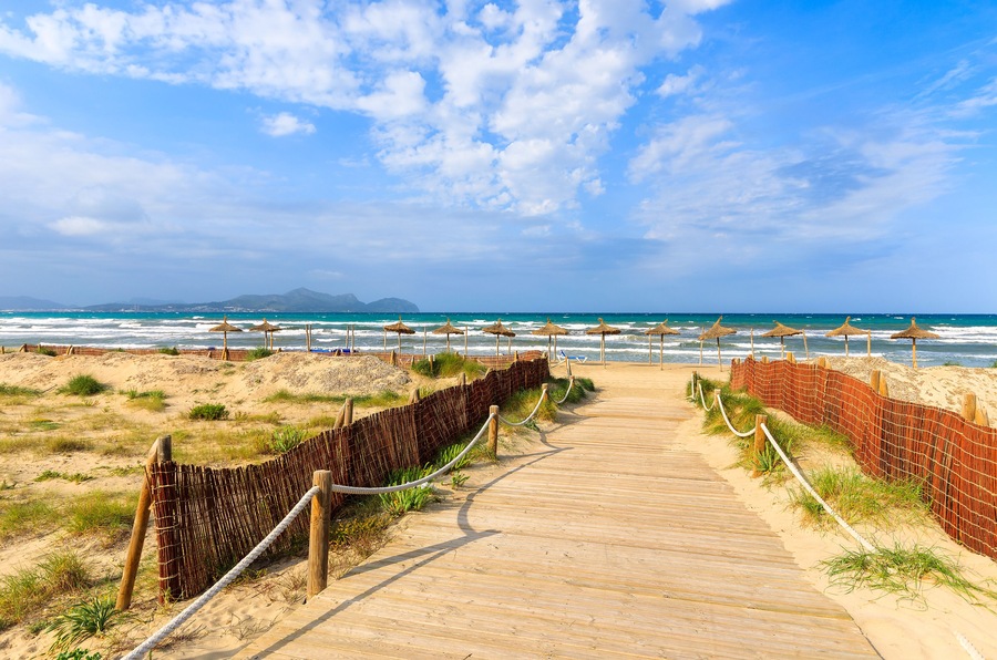 Path sandy beach sea waves white clouds blue sky, Can Picafort, Majorca island, Spain; Shutterstock ID 136391342
