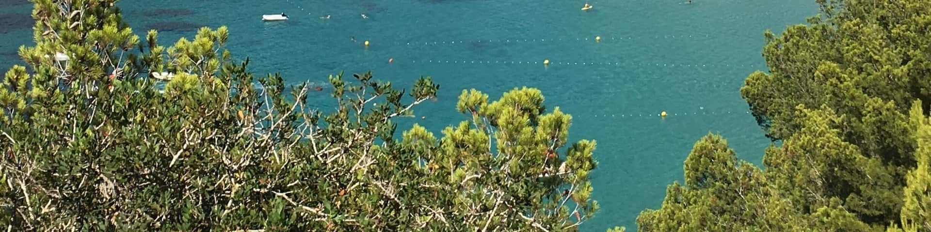 Cala de Sant Vicent in Ibiza. Ibiza is well known for its many calas (coves) with crystal clear waters. In the summer, where the south is full with party goers, why not rent a car and make your way to the North of the Island? You will enjoy beautiful sights along the way, and enjoy more tranquil waters and cheaper loungers and food #lifeatexpedia