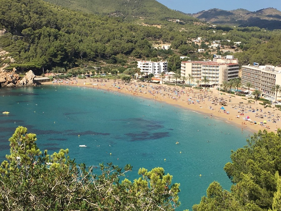 Cala de Sant Vicent in Ibiza. Ibiza is well known for its many calas (coves) with crystal clear waters. In the summer, where the south is full with party goers, why not rent a car and make your way to the North of the Island? You will enjoy beautiful sights along the way, and enjoy more tranquil waters and cheaper loungers and food #lifeatexpedia