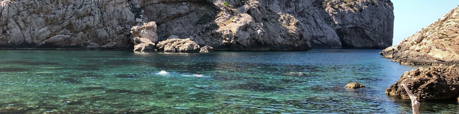 Worth the walk (around 3 miles round trip on a steep rocky path from the car park), crystal clear water and very quiet