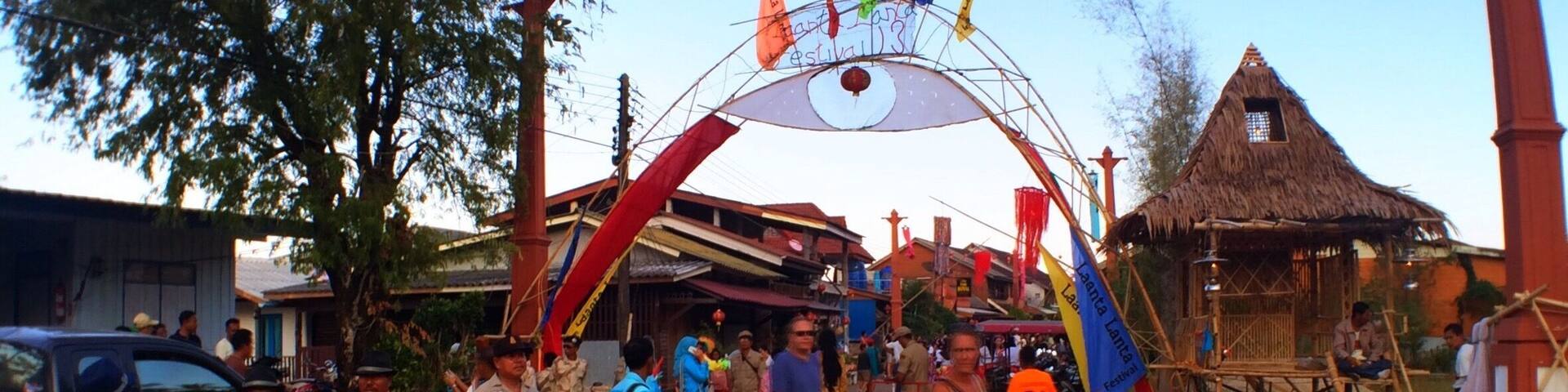 Laanta Lanta Festival. Local culture, fruit shakes, spring roll, burger and fries. Sea gypsy spirit house offering, smoking and whiskey required, drum, dance, sing. Children disco tech bounce house, hammocks, crowds, one of the pack, beat the crowd home. Motorbike with stars racing above, missed potholes, quick stop at walking street for Heems Thai/Mex leather beach purse. Consume today while.