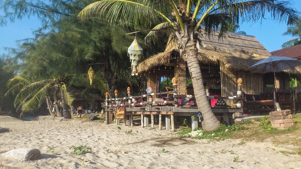 The perfect part of Long Beach in Ko Lanta. The sandy beach is long and soft, the water clear enough for a good swim. There are few bars along the beach with a really relaxed vibe, perfect for a drink when the sun is setting. From there leave the Opal 4 Islands tour, which you can't miss if you are in the area.  

http://nomadswind.com/the-best-beach/
