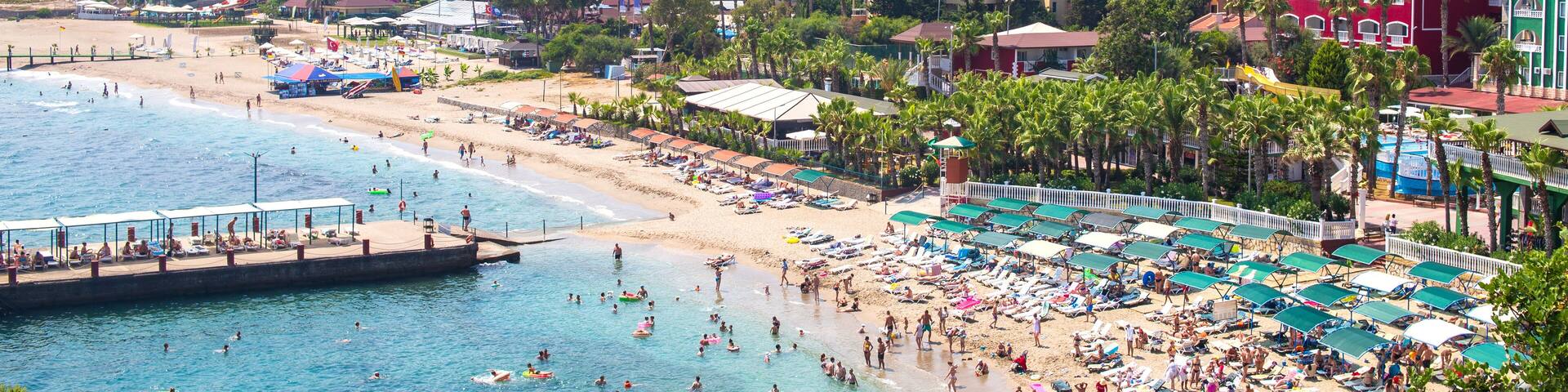 Sunny Alanya beach in Turkey with sea view. Konakli old town View from the fortress on the mountain. Mediterranean Sea