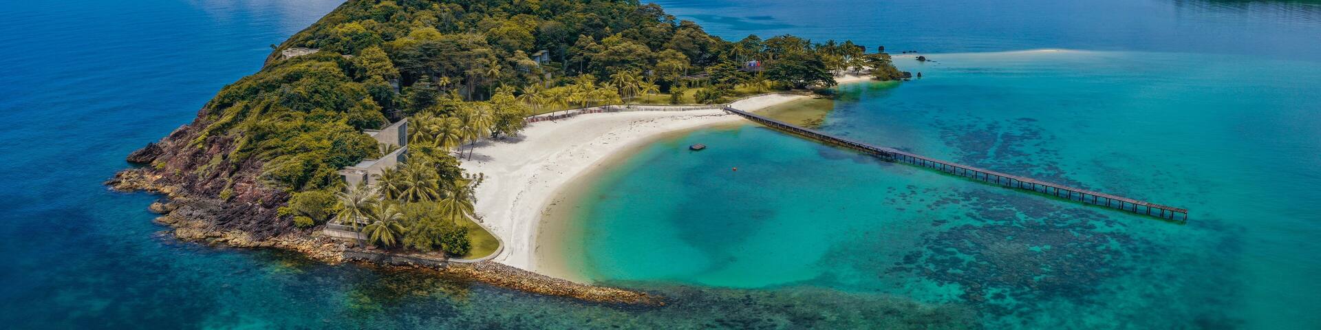 Beautiful tropical island koh Kham, white sand beach with volcanic rocks, near koh Mak, Trat, Thailand