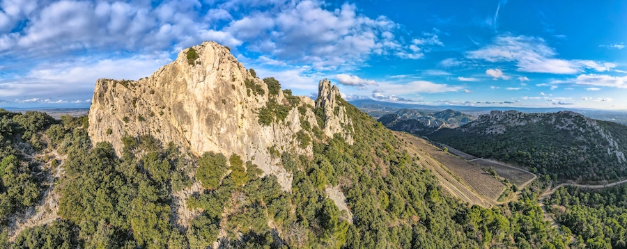 Aerial view of les Dentelles de Montmirail in front of the Mont Ventoux in the french alps
