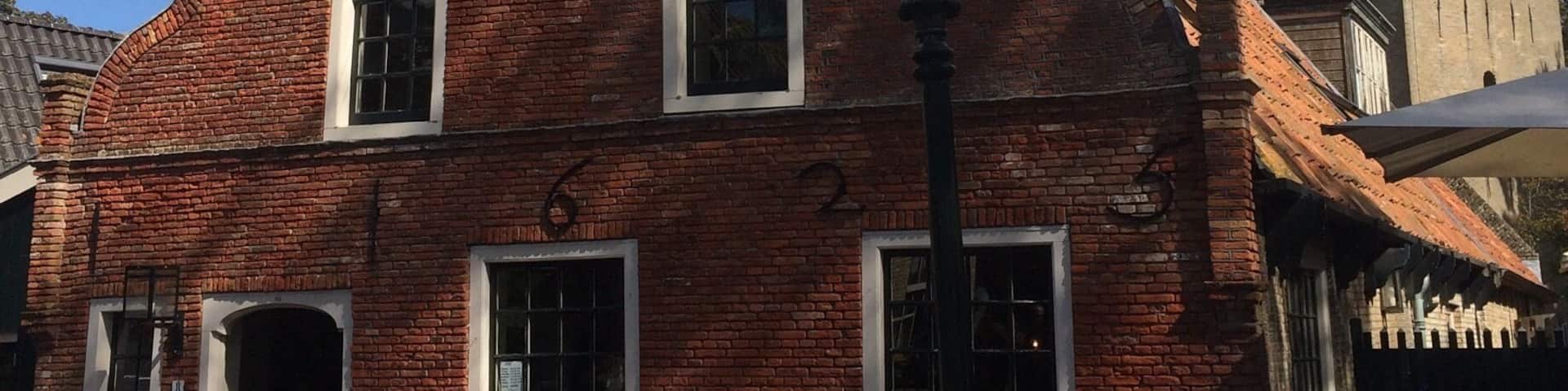 Characteristic Commandeur house on Ameland (Nes). In the background the village tower of Nes, Valerius (Watse) Frans van Cammingha and Rixt van Donia, lord and lady of Ameland instructed to build this tower in 1664. It served as a beacon for ships at sea.