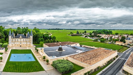 Panorama of Chateau Pichon Longueville Baron Vineyard and grape fields around Pauillac from a drone, Bordeaux, Gironde, Nouvelle-Aquitaine, France, Europe