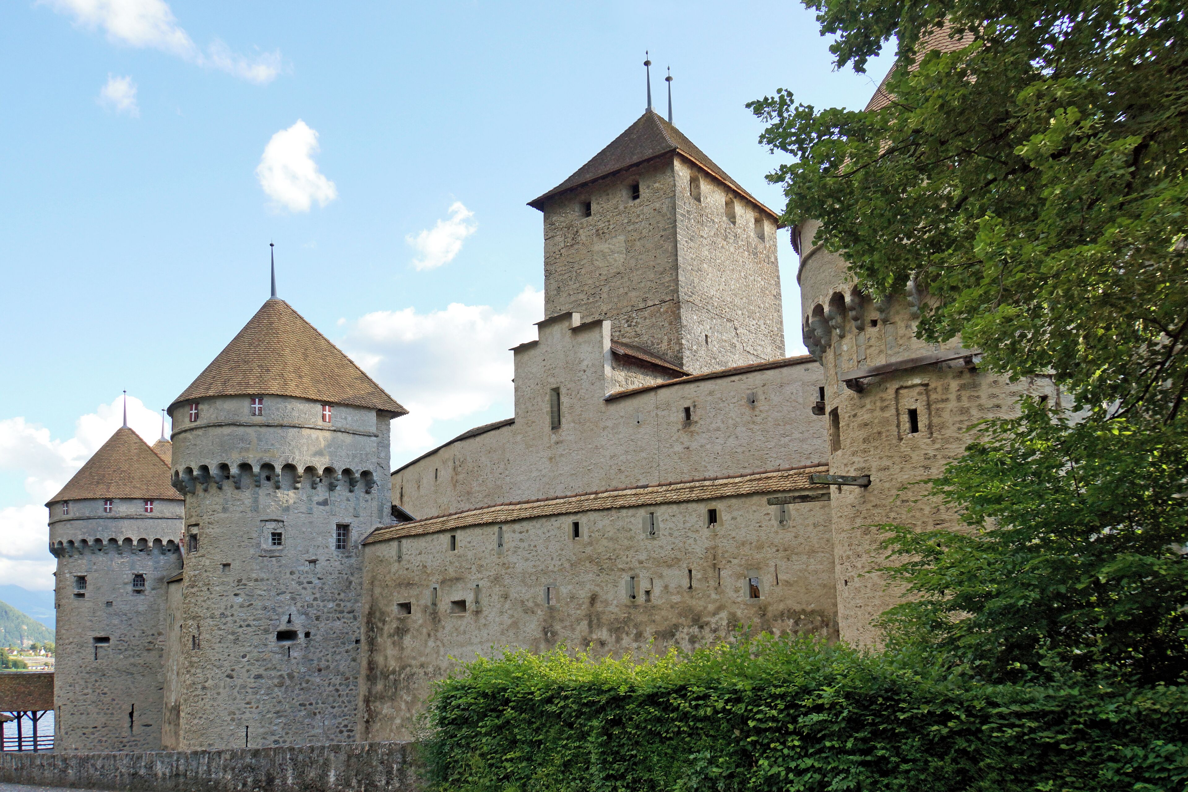 PLEASE, NO invitations or self promotions, THEY WILL BE DELETED. My photos are FREE to use, just give me credit and it would be nice if you let me know, thanks. The Château de Chillon is an island castle located on Lake Geneva. It is situated at the eastern end of the lake, on the narrow shore between Montreux and Villeneuve. Chillon is among the most visited castles in Switzerland and Europe. Chillon began as a Roman outpost, guarding the strategic road through the Alpine passes. The oldest parts of the castle have not been definitively dated, but the first written record of the castle is in 1005. Chillon was made popular by Lord Byron, who wrote the poem The Prisoner Of Chillon (1816) about François de Bonivard, Byron also carved his name on a pillar of the dungeon.