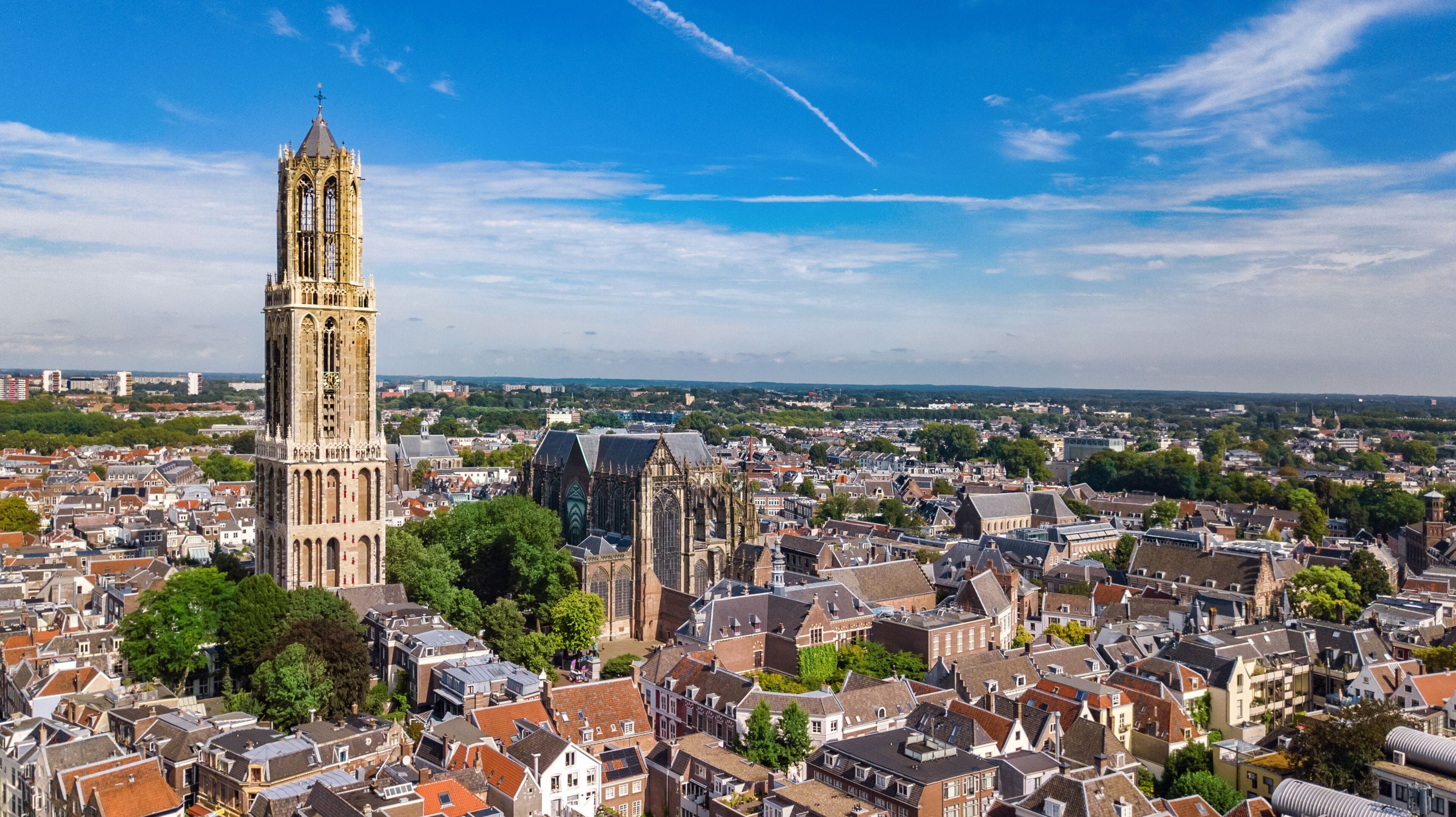 Utrecht town аerial drone view from above, typical Dutch city skyline, Utrecht cityscape with tower, canals and houses, Holland, Netherlands