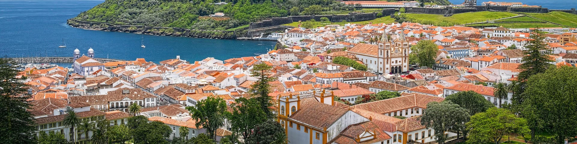 Aerial view of Angra do Heroismo city and Monte Brasil mountain, located on Azorean island of Terceira, Portugal.; Shutterstock ID 695051566; Purchase Order: -