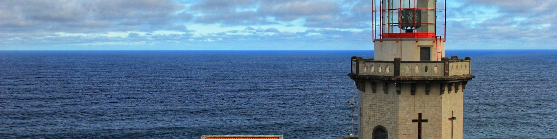 Located on the northeast coast of São Miguel, Farol do Arnel was the first lighthouse to be built in the Azores, and began operation on 26 November 1876.
It’s still a working lighthouse today, 141 years later, and is open for guided tours every Wednesday afternoon. As luck would have it, we were there on a Wednesday afternoon, but we only discovered this fact when the lighthouse keeper saw us poking around and invited us inside.
A word of warning though: if you plan to visit Farol do Arnel, park your car at the top and walk down – unless you’re a very competent driver or have an addiction to adrenaline and danger.
You can read more here:
https://galloparoundtheglobe.com/top-13-sights-not-to-miss-on-a-road-trip-around-sao-miguel-the-azores-portugal/